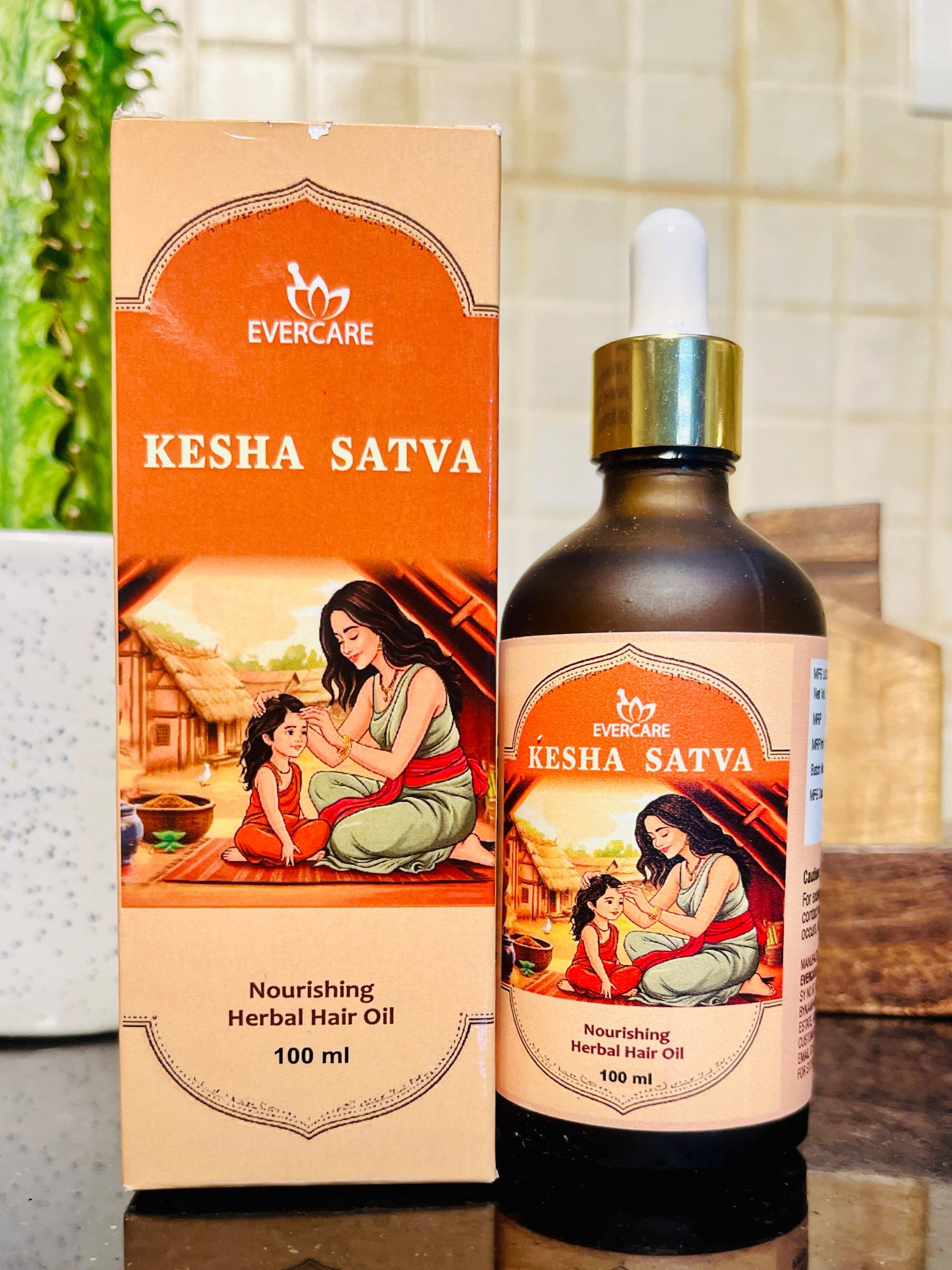 woman applying kesha satva hair oil on scalp